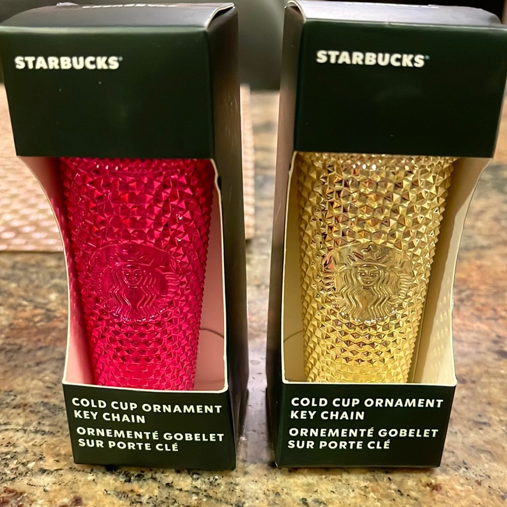 Two Starbucks pink and gold key chains sold as a pair